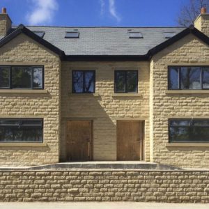 Stone built house featuring pitch faced walling stones